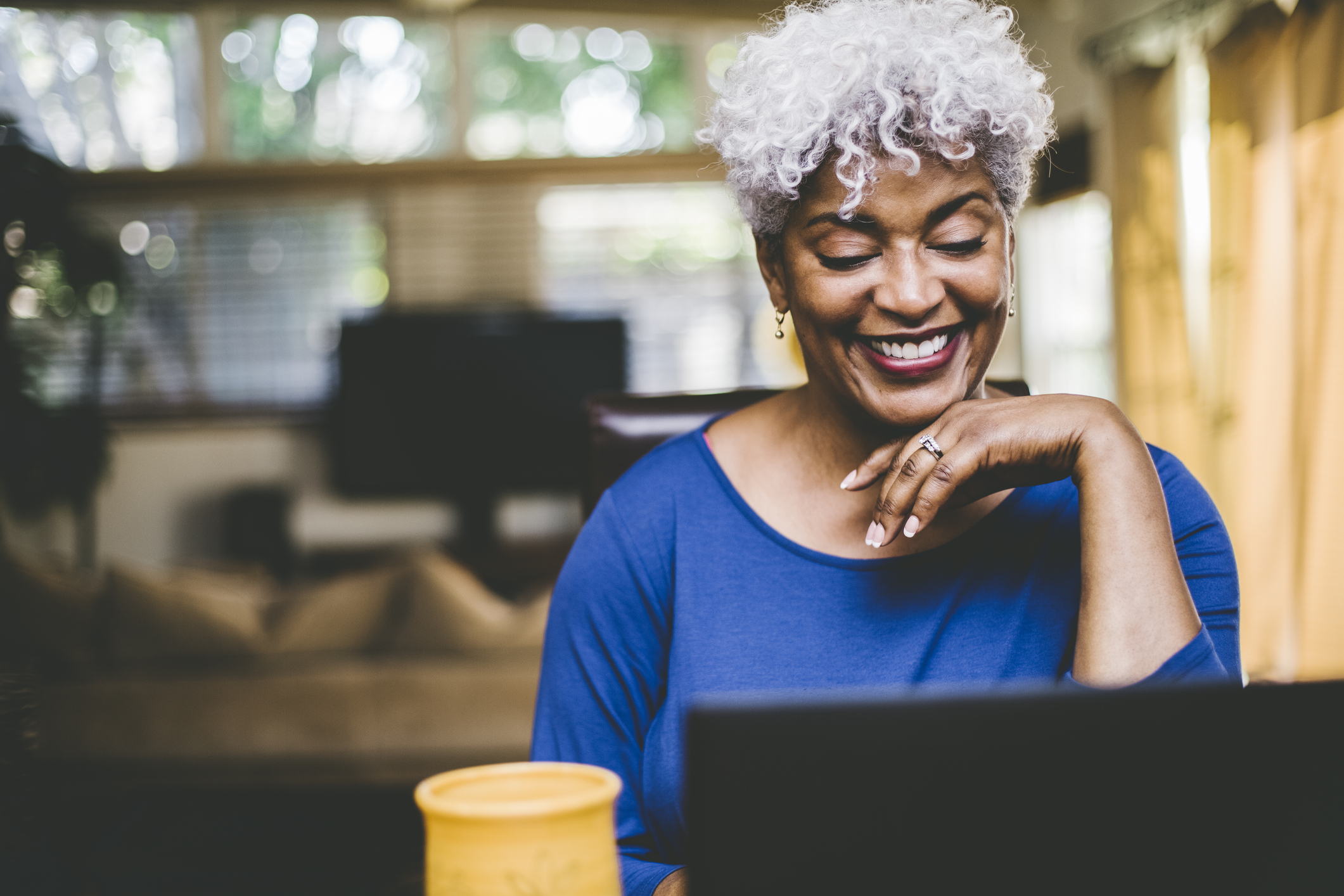 European Accessibility Act - woman smiling at computer