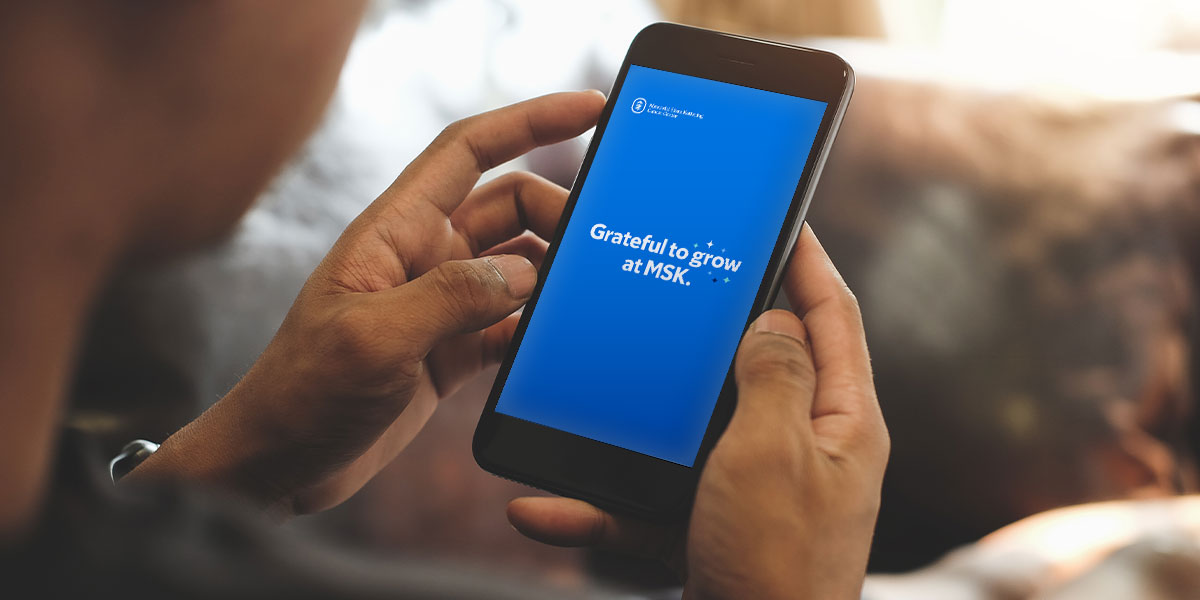 phone with campaign messaging of MSK grateful to grow